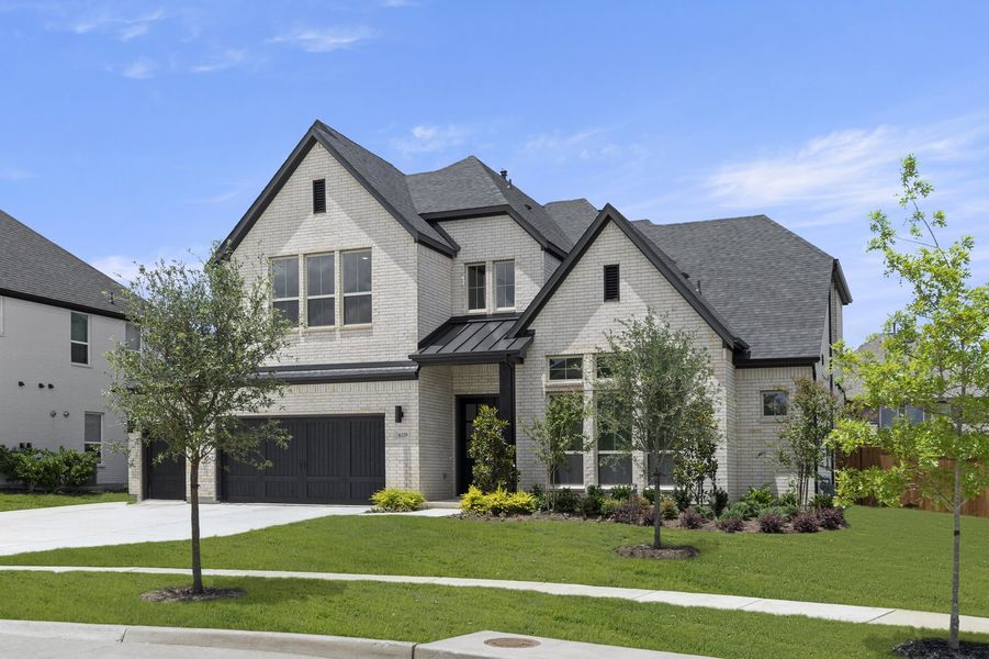 Front exterior of a new home in Estates at Rockhill, Frisco, TX, highlighting curb appeal (Image 2). Front exterior of a new home in Estates at Rockhill, Frisco, TX, highlighting curb appeal (Image 2).