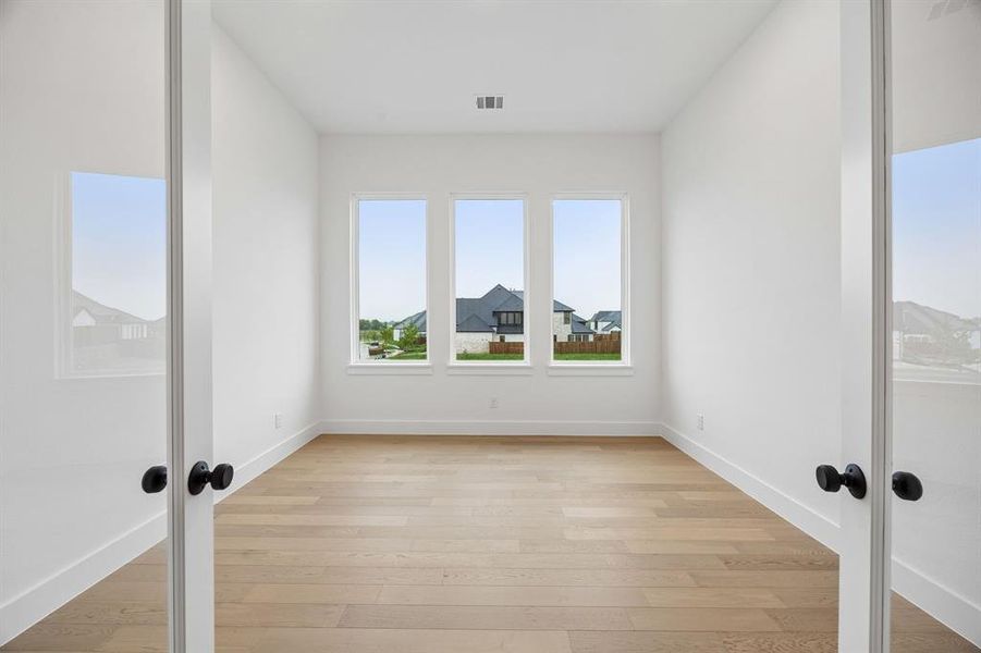 Whether it's working from home or enjoying a good book, you will appreciate this bright and spacious home office.