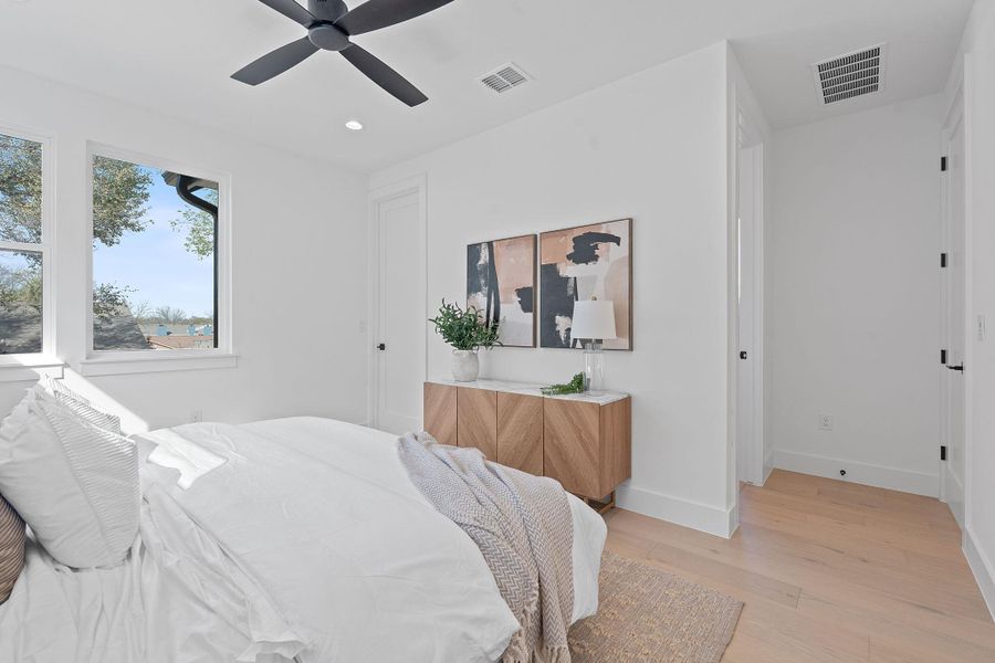 Bedroom featuring recessed lighting, visible vents, baseboards, and light wood-style flooring