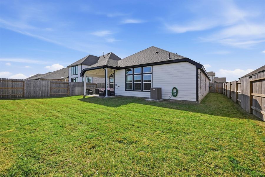 Exterior details and patio area of a home in Oakwood Estates, Waller (Image 3).
