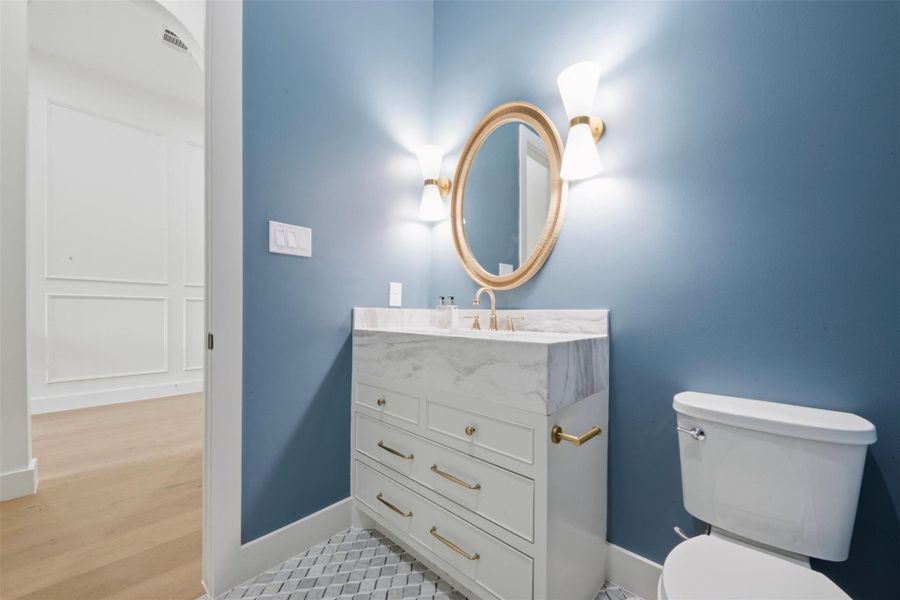 Powder Bath with Marble Mosaic Flooring and Counter Tops