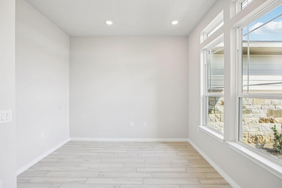 Unfurnished room featuring light wood-style floors and recessed lighting