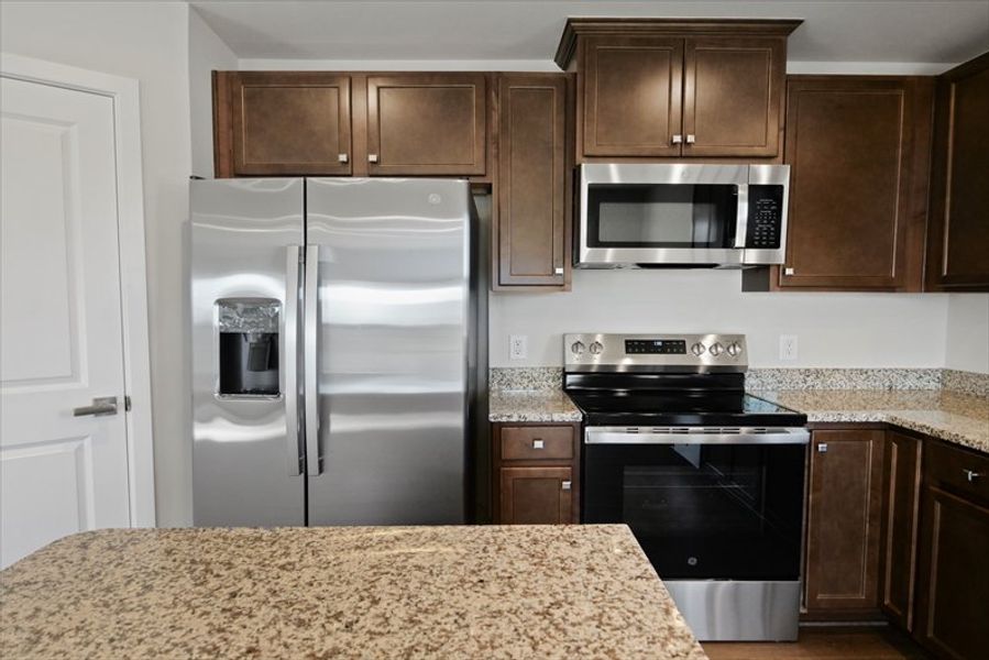 Furnished interior view inside a new home in Reidville Town Center Cottages, Duncan (Image 7).
