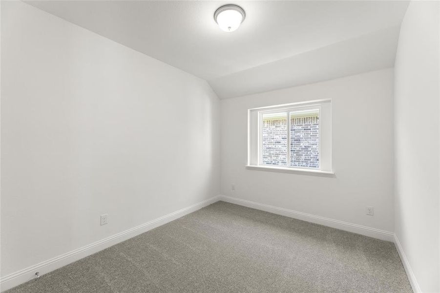 Spare room with ceiling fan, a healthy amount of sunlight, and light wood-type flooring