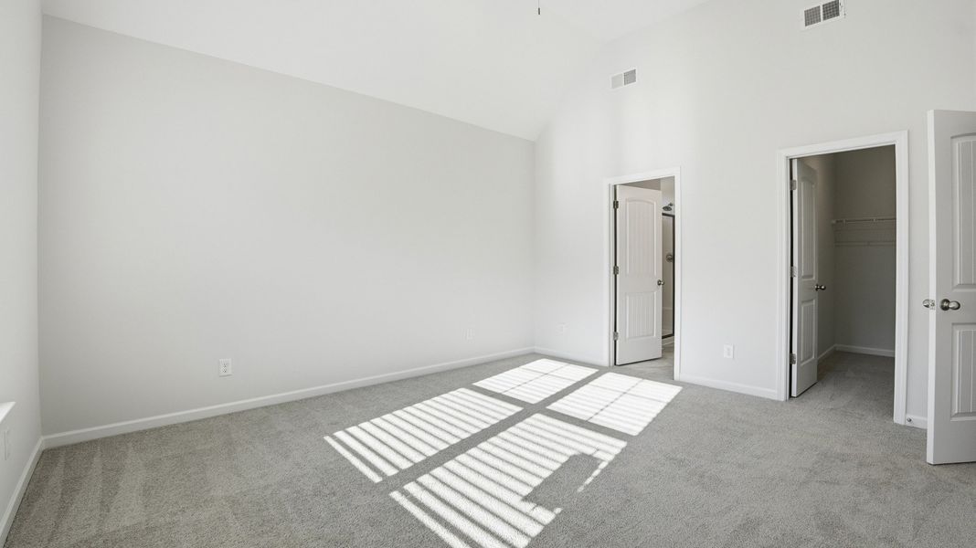 another view of the primary bedroom