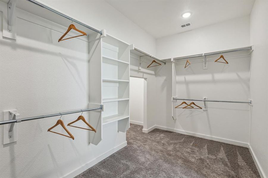 Primary Closet in the Wimbledon home plan by Trophy Signature Homes – REPRESENTATIVE PHOTO Primary Closet in the Wimbledon home plan by Trophy Signature Homes – REPRESENTATIVE PHOTO
