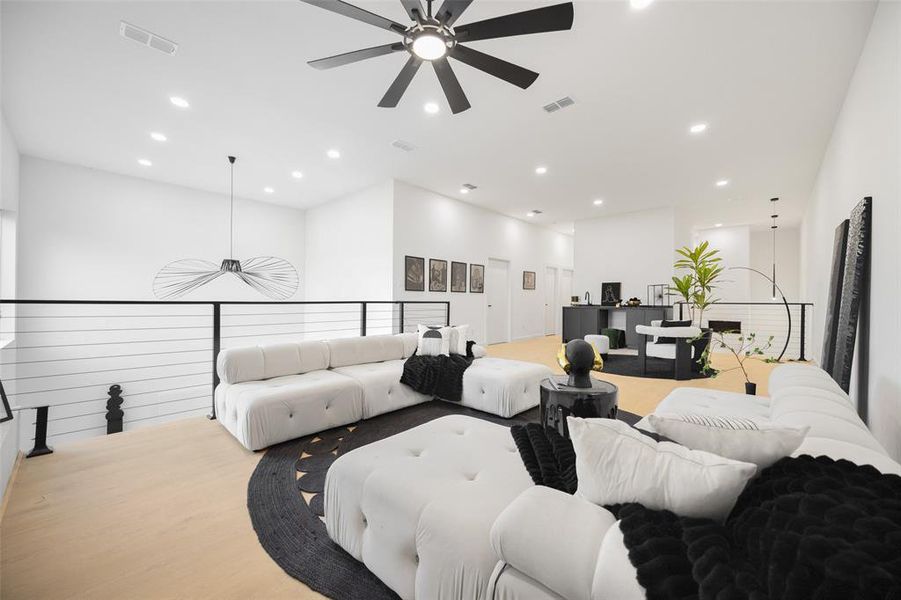 Family room featuring ceiling fan, recessed lighting, and light wood finished floors
