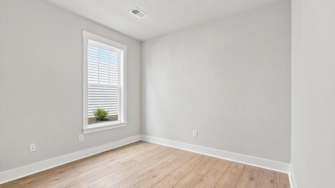 Thoughtfully designed secondary bedrooms featuring hardwood flooring and tasteful detail Thoughtfully designed secondary bedrooms featuring hardwood flooring and tasteful detail