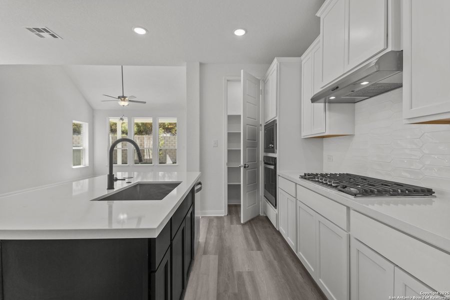 Furnished interior view inside a new home in Ladera 50', San Antonio (Image 9).