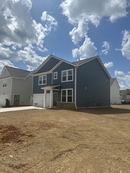 Front exterior of a new home in Sage Farms, White House, TN, highlighting curb appeal (Image 76).