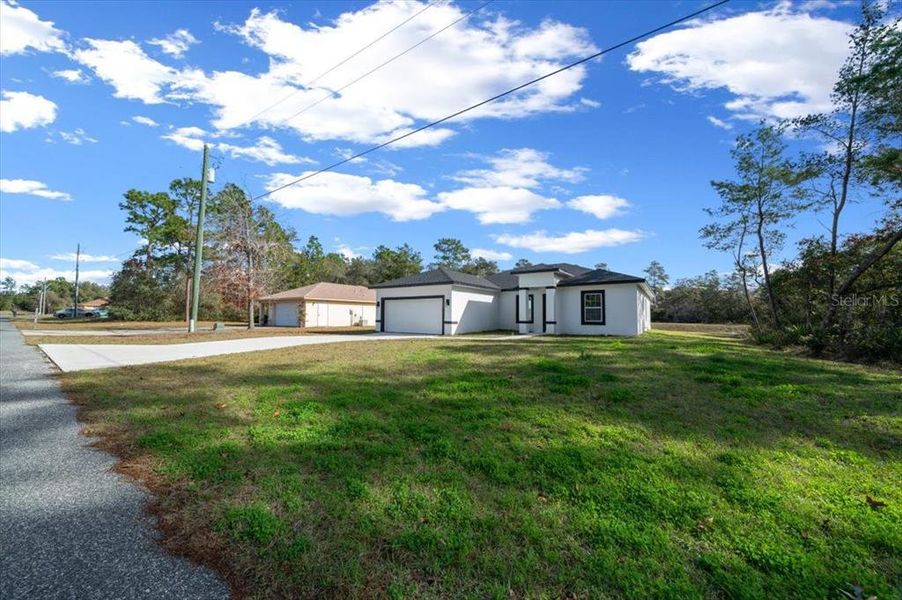 Front exterior of a new home in , Ocala, FL, highlighting curb appeal (Image 28).