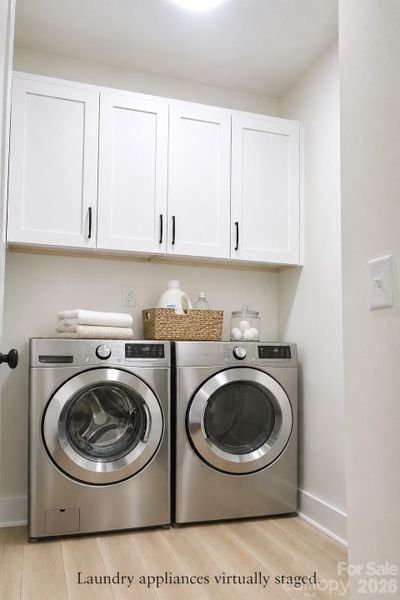 Laundry room is spacious. (Appliances virtually added.)