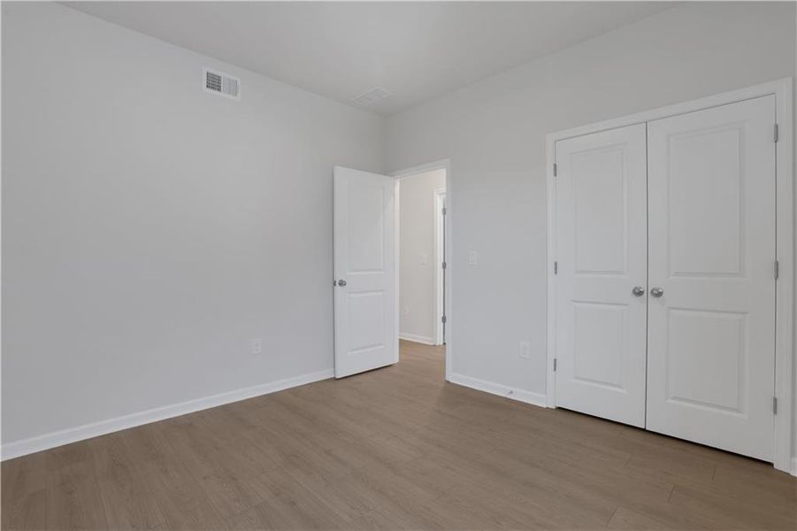 Spacious, unfurnished interior of a new home in The Paddocks at Doc Hughes, Buford (Image 40).