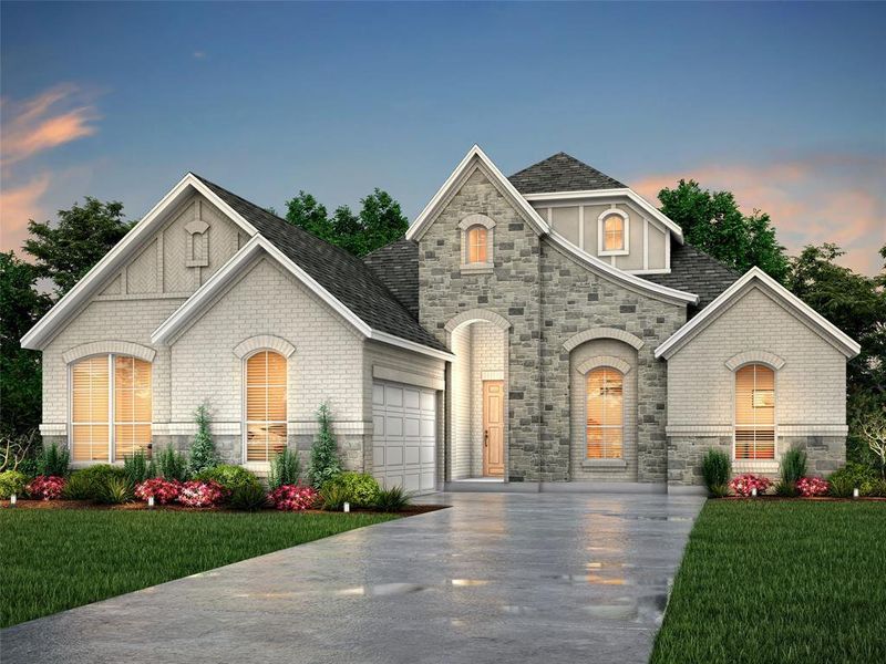 French country inspired facade featuring a yard and a garage