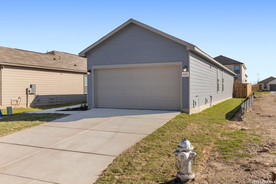 Front exterior of a new home in Spanish Trails, San Antonio, TX, highlighting curb appeal (Image 18). Front exterior of a new home in Spanish Trails, San Antonio, TX, highlighting curb appeal (Image 18).