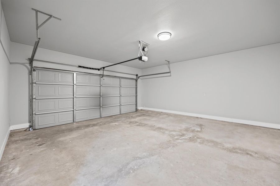 Garage featuring baseboards Garage featuring baseboards
