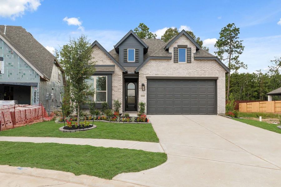 Front exterior of a new home in Evergreen, Conroe, TX, highlighting curb appeal (Image 1). Front exterior of a new home in Evergreen, Conroe, TX, highlighting curb appeal (Image 1).