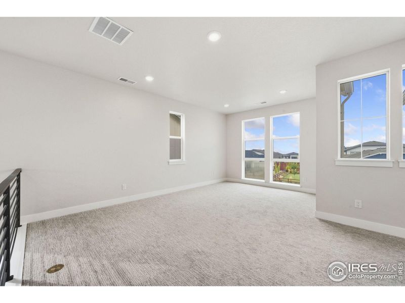 Spacious, unfurnished interior of a new home in Festival at RainDance, Windsor (Image 14).