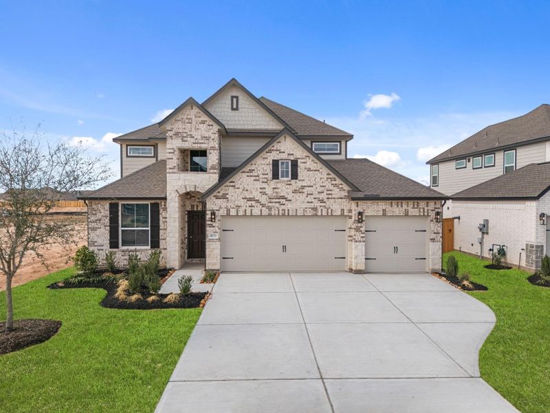 Front exterior of a new home in Sunterra Lakes, Fulshear, TX, highlighting curb appeal (Image 20).
