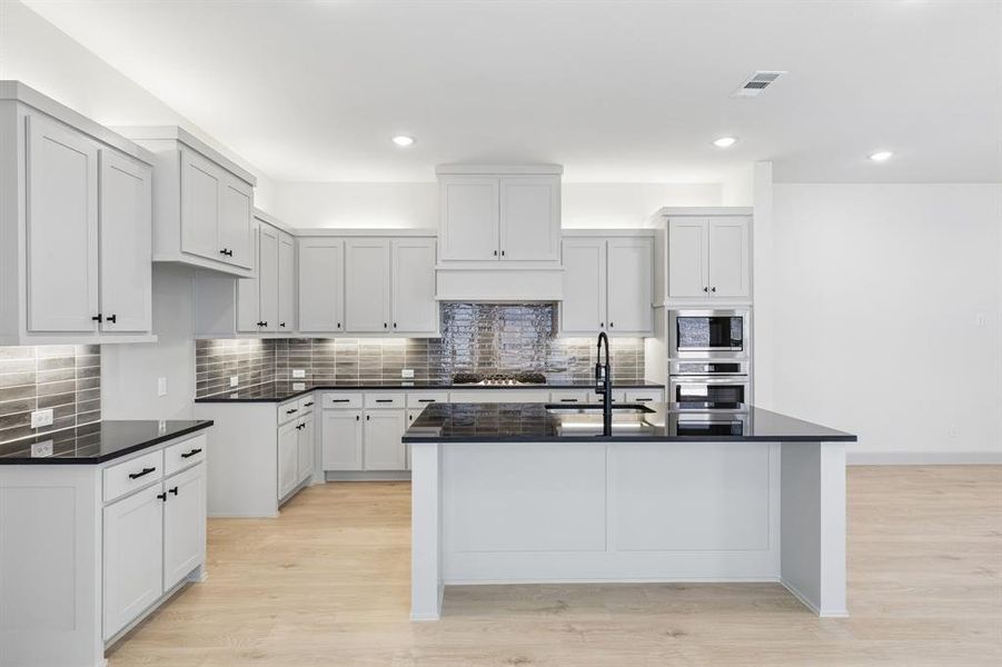 Featuring a timeless black and white color palette, this dream kitchen is one for the ages! Featuring a timeless black and white color palette, this dream kitchen is one for the ages!