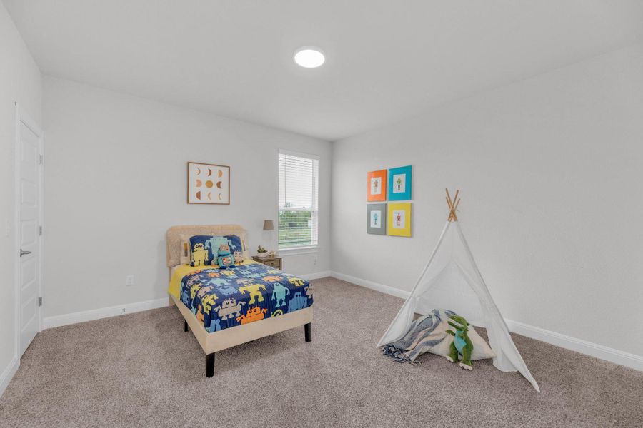 Bedroom with carpet flooring and baseboards