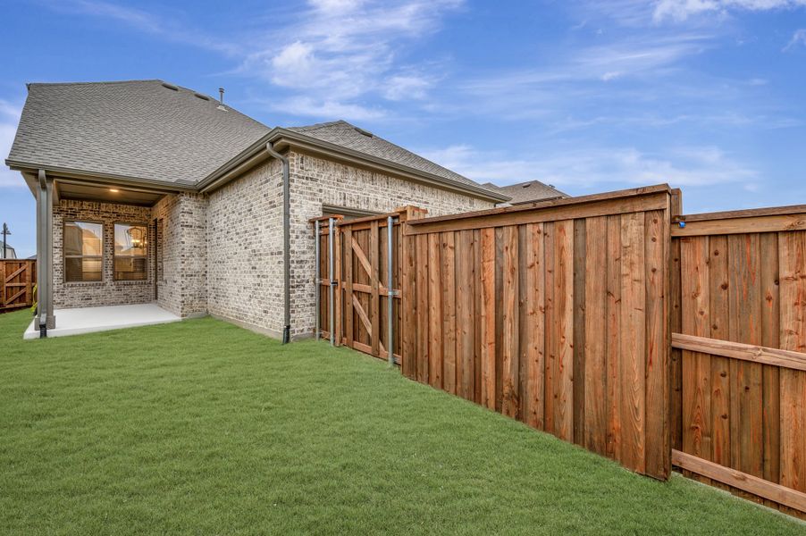 Exterior details and patio area of a home in Mantua Point Gardens, Van Alstyne (Image 3). Exterior details and patio area of a home in Mantua Point Gardens, Van Alstyne (Image 3).