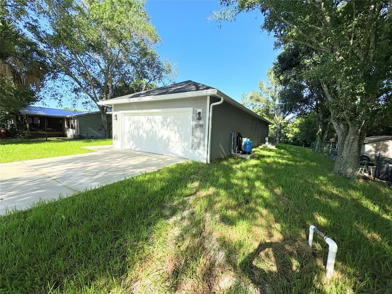 Front exterior of a new home in , Okeechobee, FL, highlighting curb appeal (Image 26).