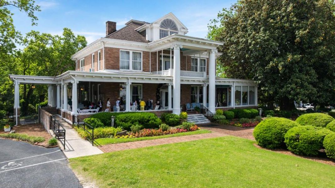 Front exterior of a new home in Pointe Park, Union City, GA, highlighting curb appeal (Image 1).