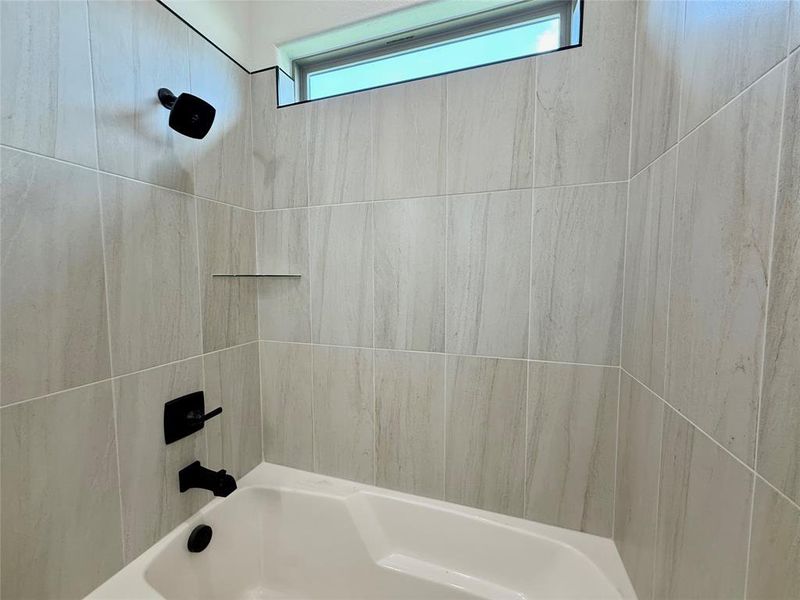 Full bath featuring bathing tub / shower combination
