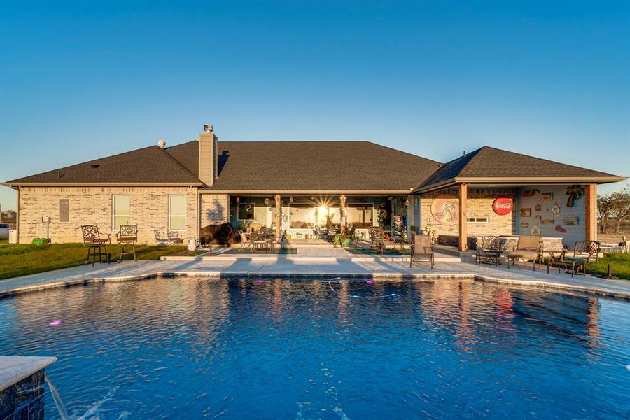 View of swimming pool with a patio area