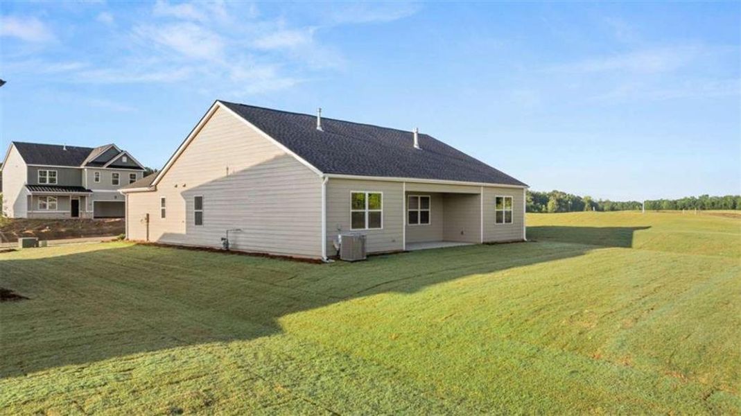 Exterior details and patio area of a home in Preserve at Dove Creek, Statham (Image 28).