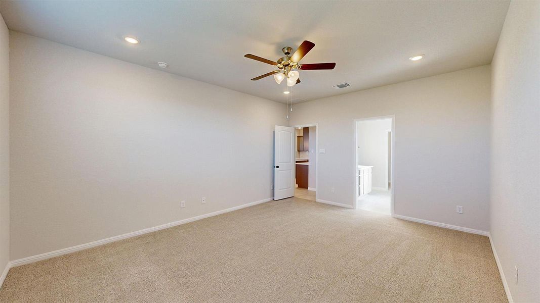 Unfurnished bedroom with light colored carpet, recessed lighting, and a ceiling fan