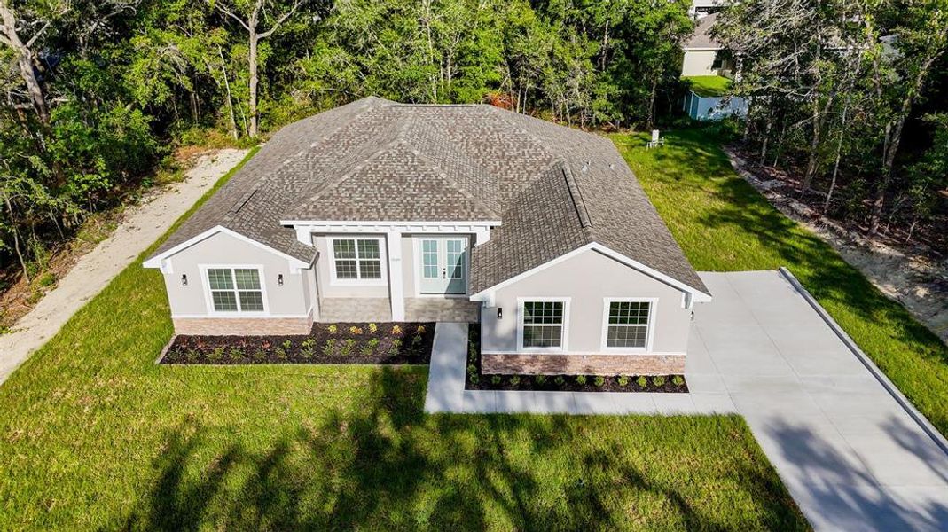 Front exterior of a new home in , Summerfield, FL, highlighting curb appeal (Image 18). Front exterior of a new home in , Summerfield, FL, highlighting curb appeal (Image 18).