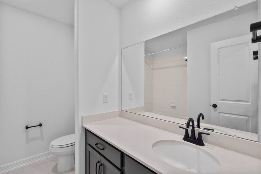 Upstairs bathroom featuring beautiful matte black plumbing and cabinet pulls.