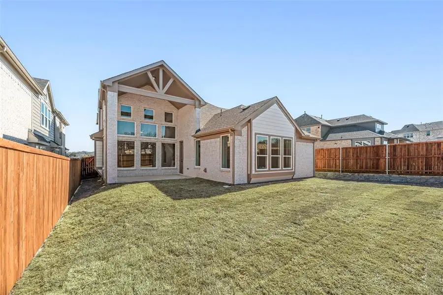 Exterior details and patio area of a home in Providence Cove, McKinney (Image 2). Exterior details and patio area of a home in Providence Cove, McKinney (Image 2).