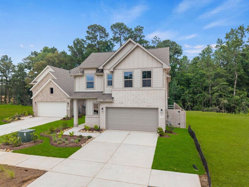 Front exterior of a new home in Two Step Farm, Montgomery, TX, highlighting curb appeal (Image 2). Front exterior of a new home in Two Step Farm, Montgomery, TX, highlighting curb appeal (Image 2).