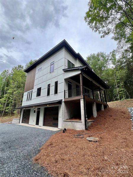 Side view with covered deck/porch Side view with covered deck/porch