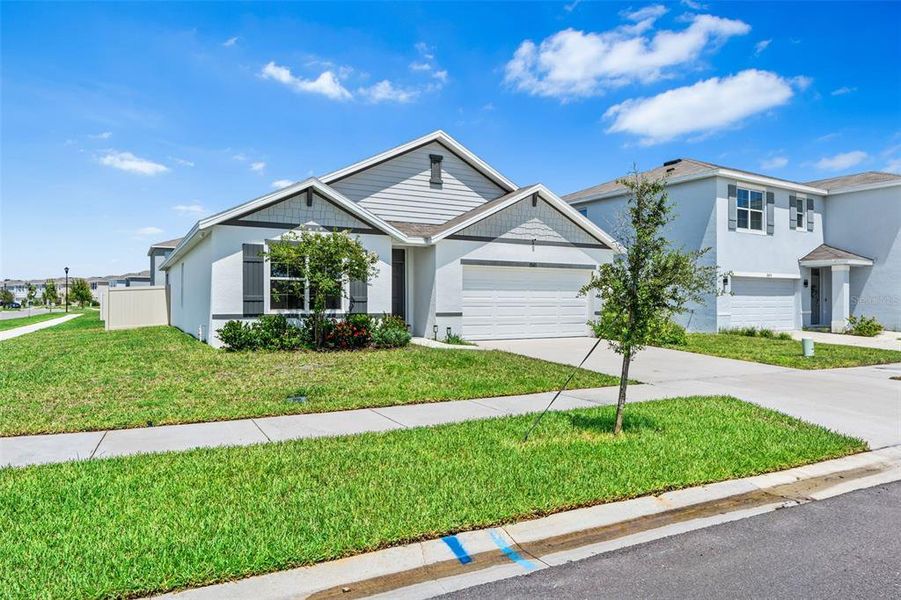 Front exterior of a new home in , Wesley Chapel, FL, highlighting curb appeal (Image 25).