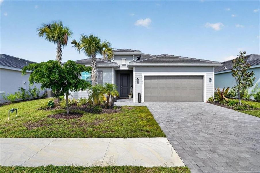 Front exterior of a new home in , Venice, FL, highlighting curb appeal (Image 1). Front exterior of a new home in , Venice, FL, highlighting curb appeal (Image 1).