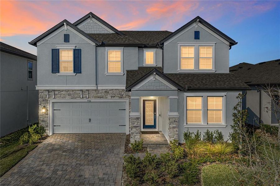Front exterior of a new home in Epperson, Wesley Chapel, FL, highlighting curb appeal (Image 2). Front exterior of a new home in Epperson, Wesley Chapel, FL, highlighting curb appeal (Image 2).