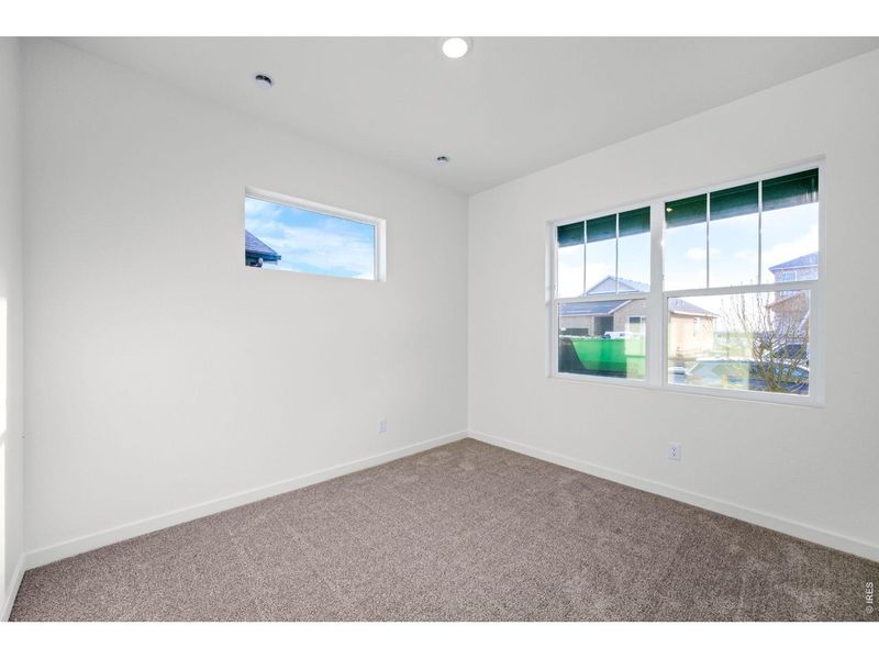 Spacious, unfurnished interior of a new home in Union Colony West, Greeley (Image 11).