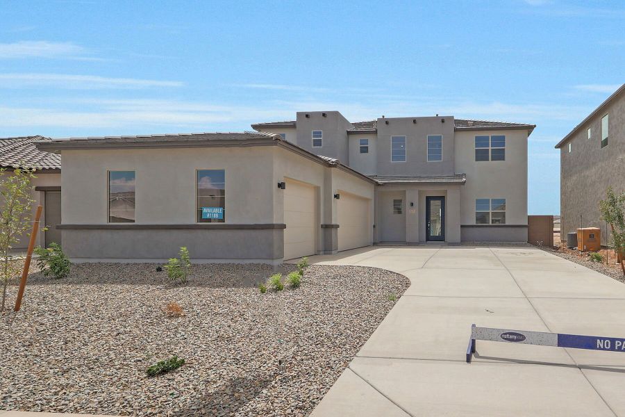 Front exterior of a new home in Landmarke, San Tan Valley, AZ, highlighting curb appeal (Image 1). Front exterior of a new home in Landmarke, San Tan Valley, AZ, highlighting curb appeal (Image 1).