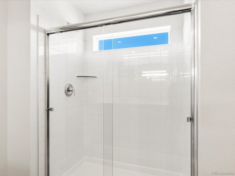 Spacious, unfurnished interior of a new home in Ridgeline Vista: The Flora Collection, Brighton (Image 26).