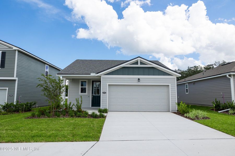 Front exterior of a new home in Sandridge Hills, Green Cove Springs, FL, highlighting curb appeal (Image 1). Front exterior of a new home in Sandridge Hills, Green Cove Springs, FL, highlighting curb appeal (Image 1).