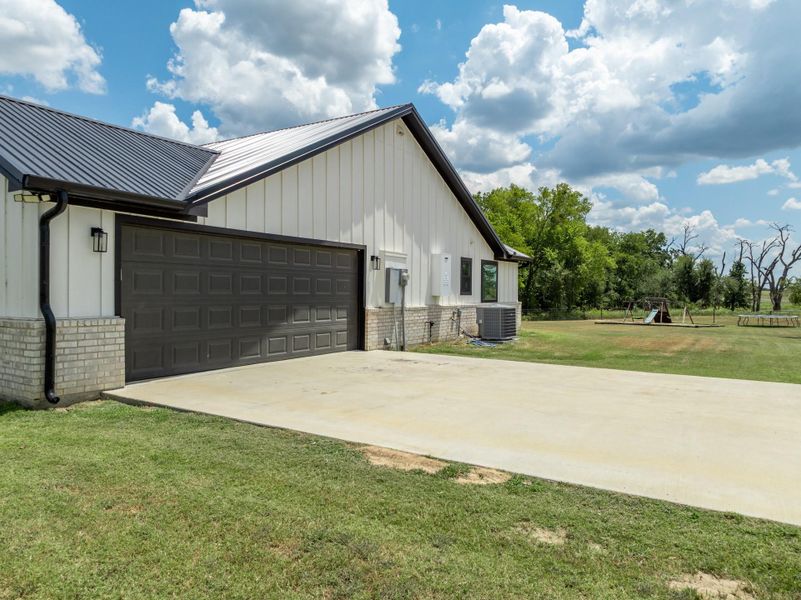 Front exterior of a new home in , Rockdale, TX, highlighting curb appeal (Image 23).