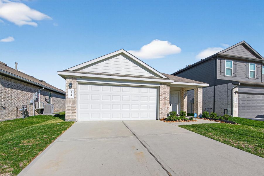 Front exterior of a new home in , Spring, TX, highlighting curb appeal (Image 23). Front exterior of a new home in , Spring, TX, highlighting curb appeal (Image 23).