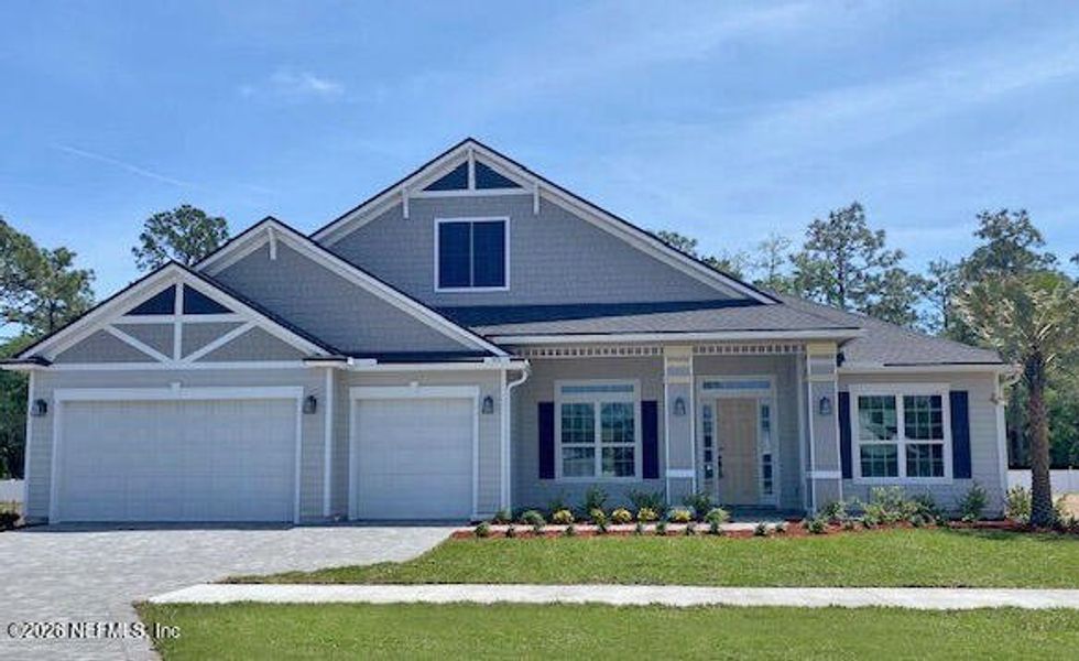 Front exterior of a new home in Sandy Bluff, Yulee, FL, highlighting curb appeal (Image 1). Front exterior of a new home in Sandy Bluff, Yulee, FL, highlighting curb appeal (Image 1).