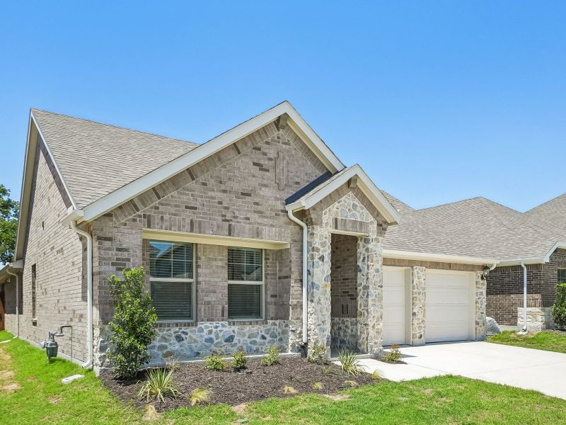 Front exterior of a new home in Stella Hills, Denton, TX, highlighting curb appeal (Image 2). Front exterior of a new home in Stella Hills, Denton, TX, highlighting curb appeal (Image 2).