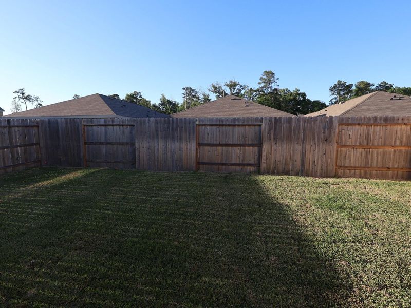 Exterior details and patio area of a home in Pinewood at Grand Texas, New Caney (Image 3).