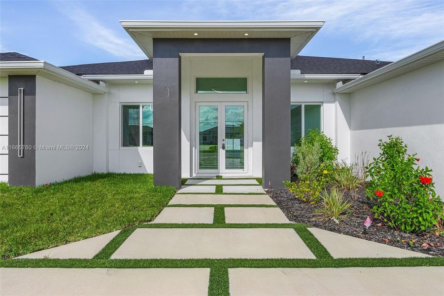 Front exterior of a new home in , Cape Coral, FL, highlighting curb appeal (Image 16). Front exterior of a new home in , Cape Coral, FL, highlighting curb appeal (Image 16).